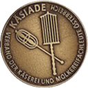 Kasiade award with traditional cheese tools on a round medal.